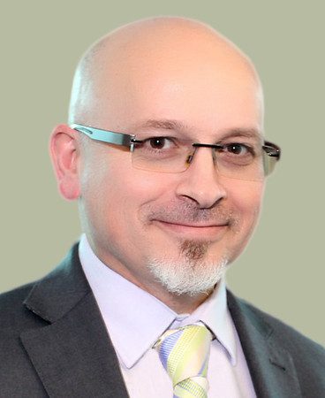 a man wearing glasses a suit and tie, jovan kurbalija, Jovan Kurbalija