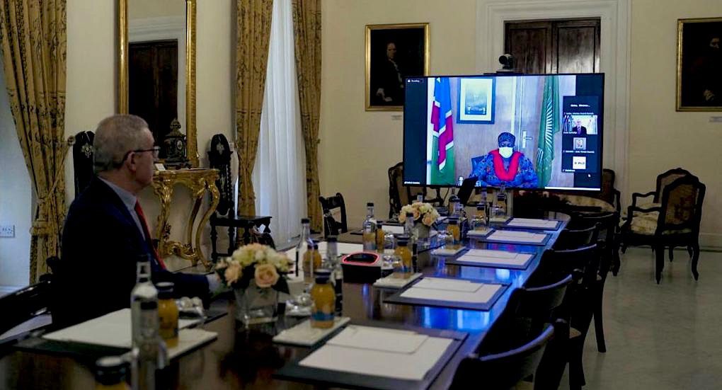 Malta's Minister for Foreign and European Affairs Evarist Bartolo listens to Namibia’s Deputy Prime Minister and Minister of International Relations and Cooperation Netumbo Nandi-Ndaitwah via video-conference